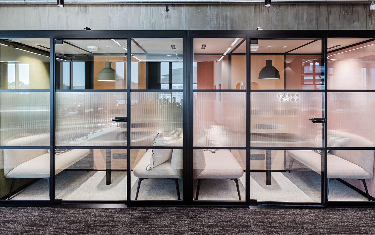 Corporate office interior with employees’ desks and seating