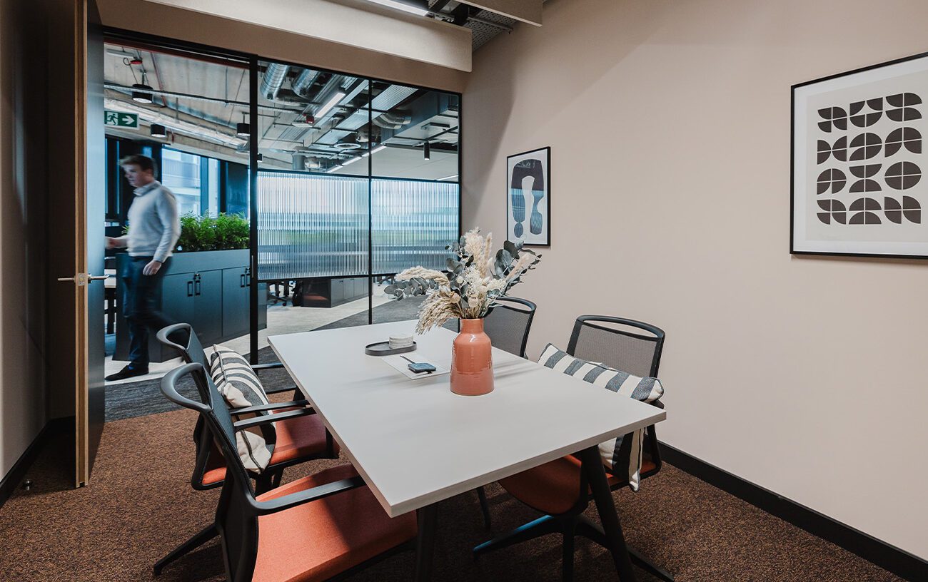 Open-plan workstation setup inside DMS corporate office