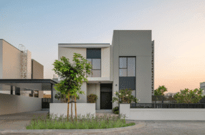 Modern villa exterior front view with landscaped entrance