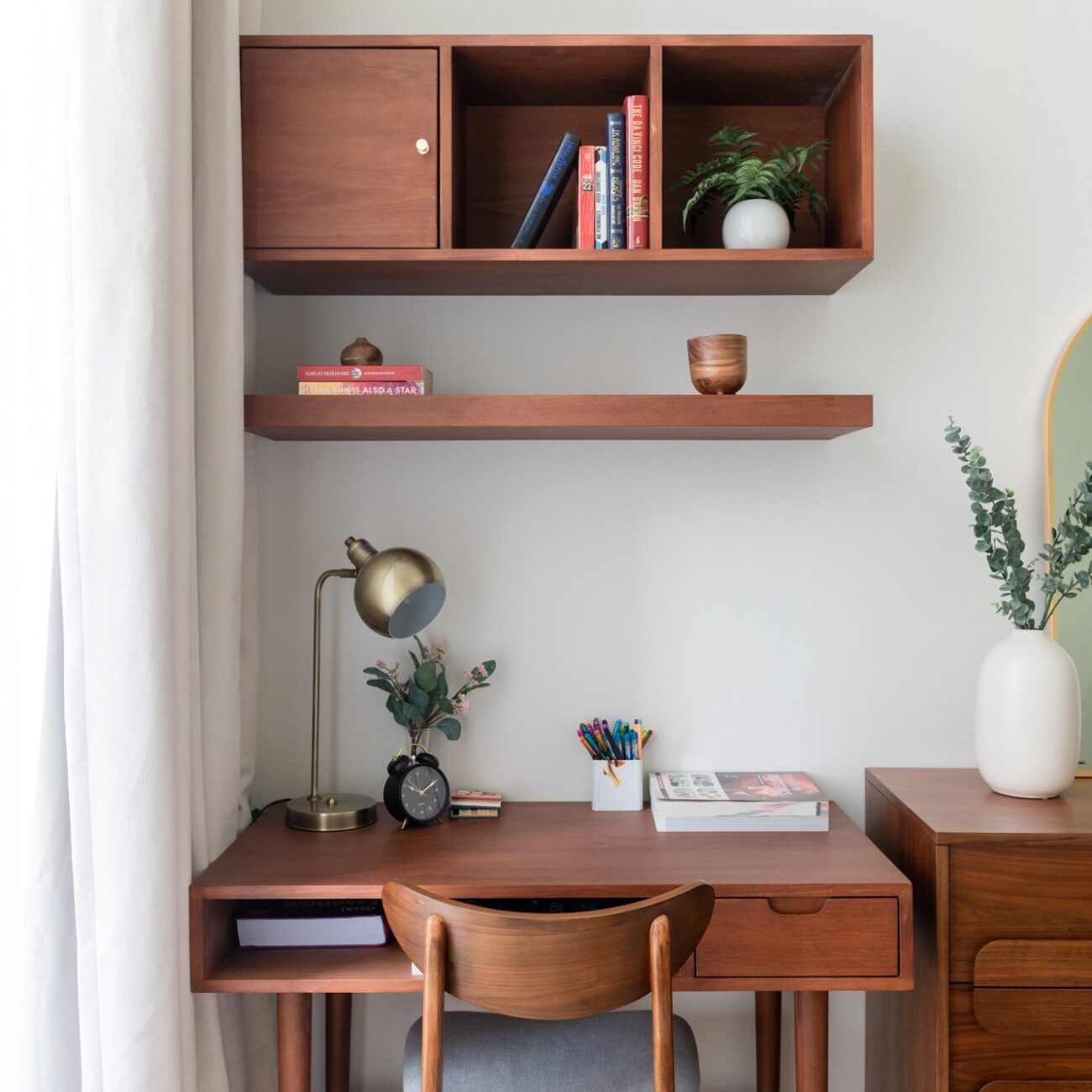 Spacious villa bedroom with sleek furniture set and cozy armchair in Courtyard Villa