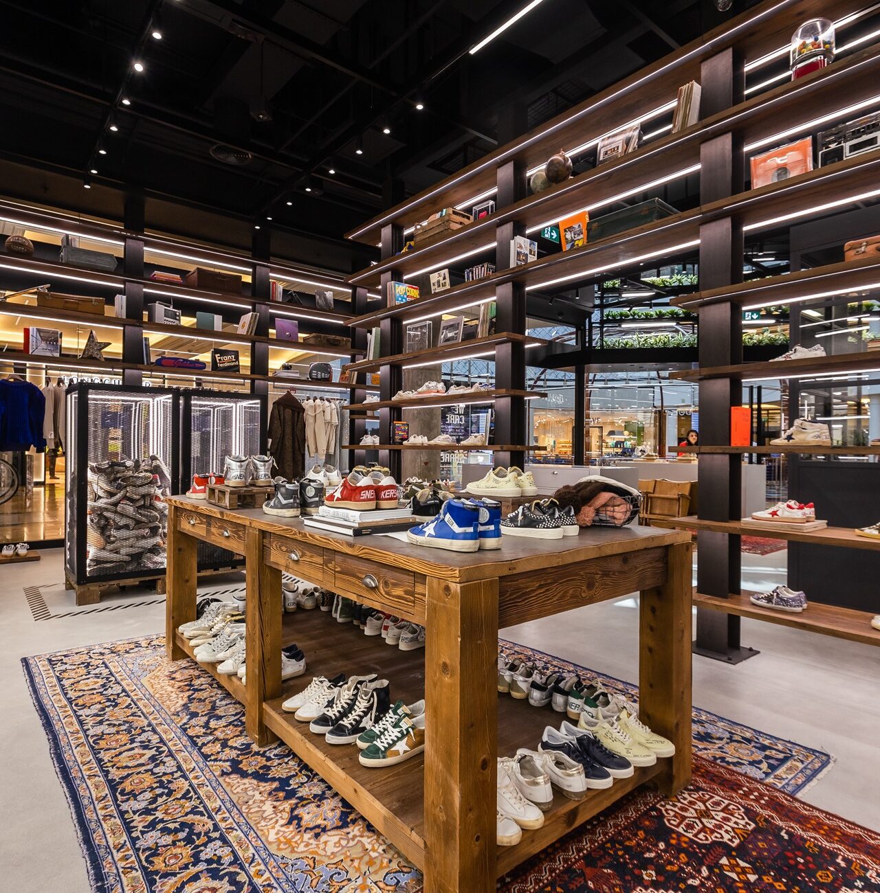 Golden Goose Mall of the Emirates product display shelves showcasing designer footwear and accessories