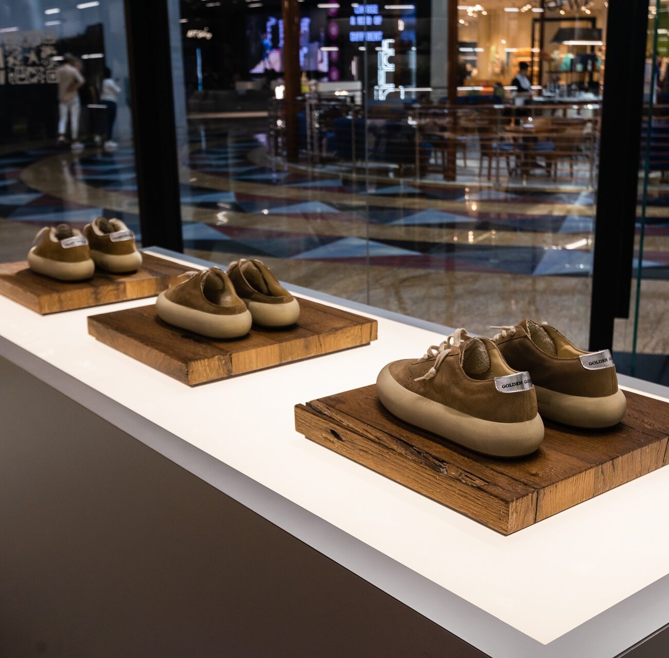 Close-up of product display area at Golden Goose store interior