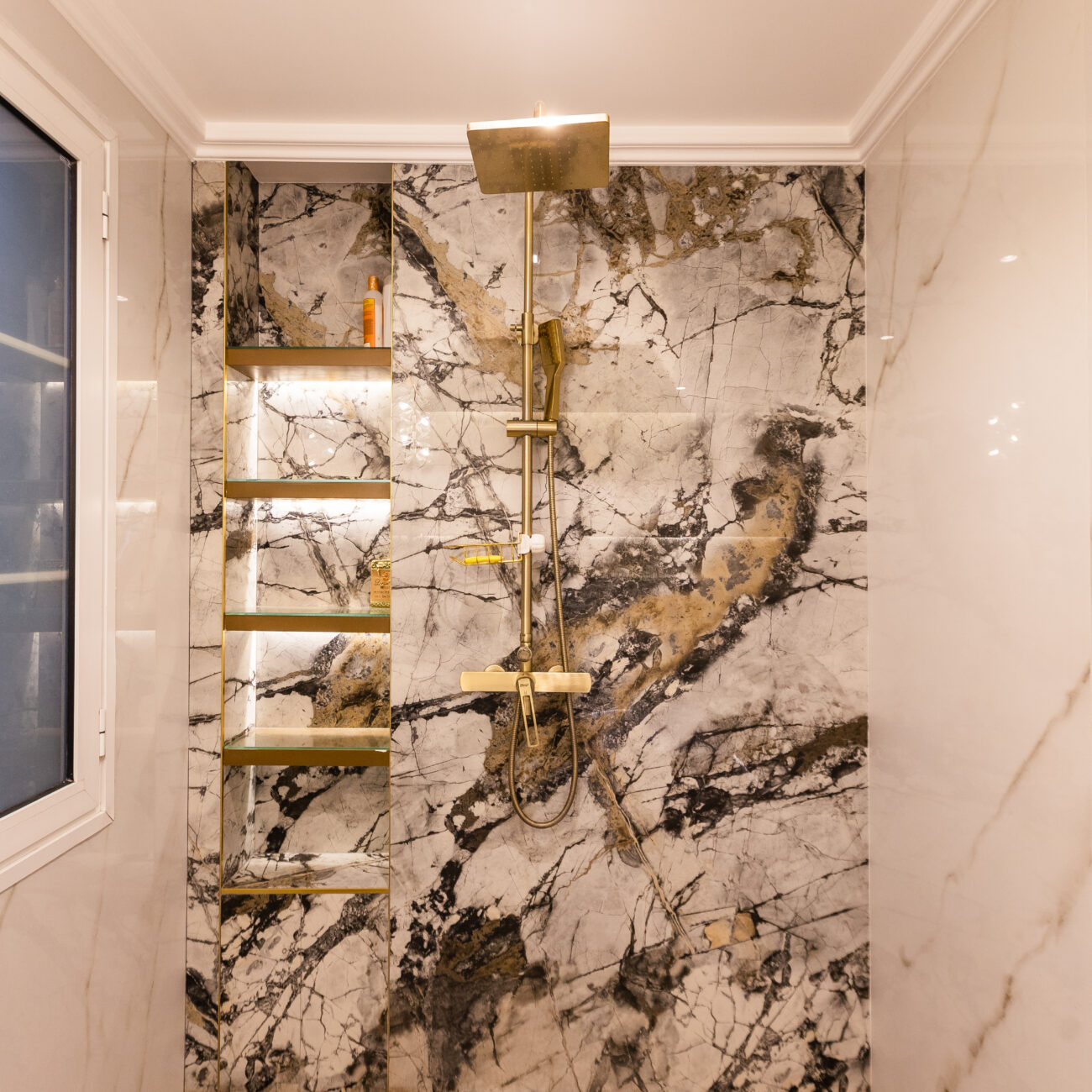 Villa washroom with premium tiles and modern accessories