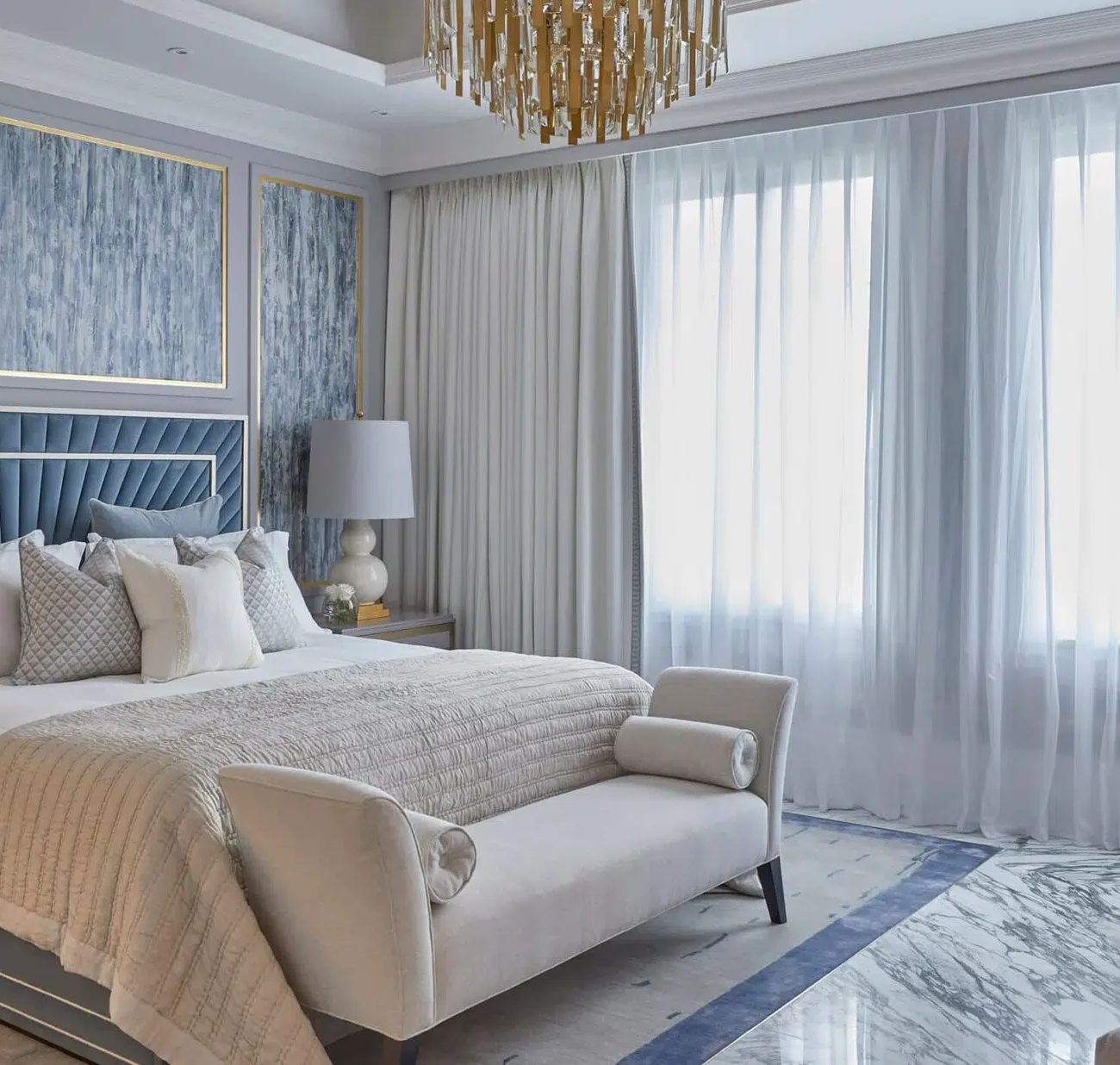 Master bedroom interior with large bed and modern décor in Nad Al Shiba villa