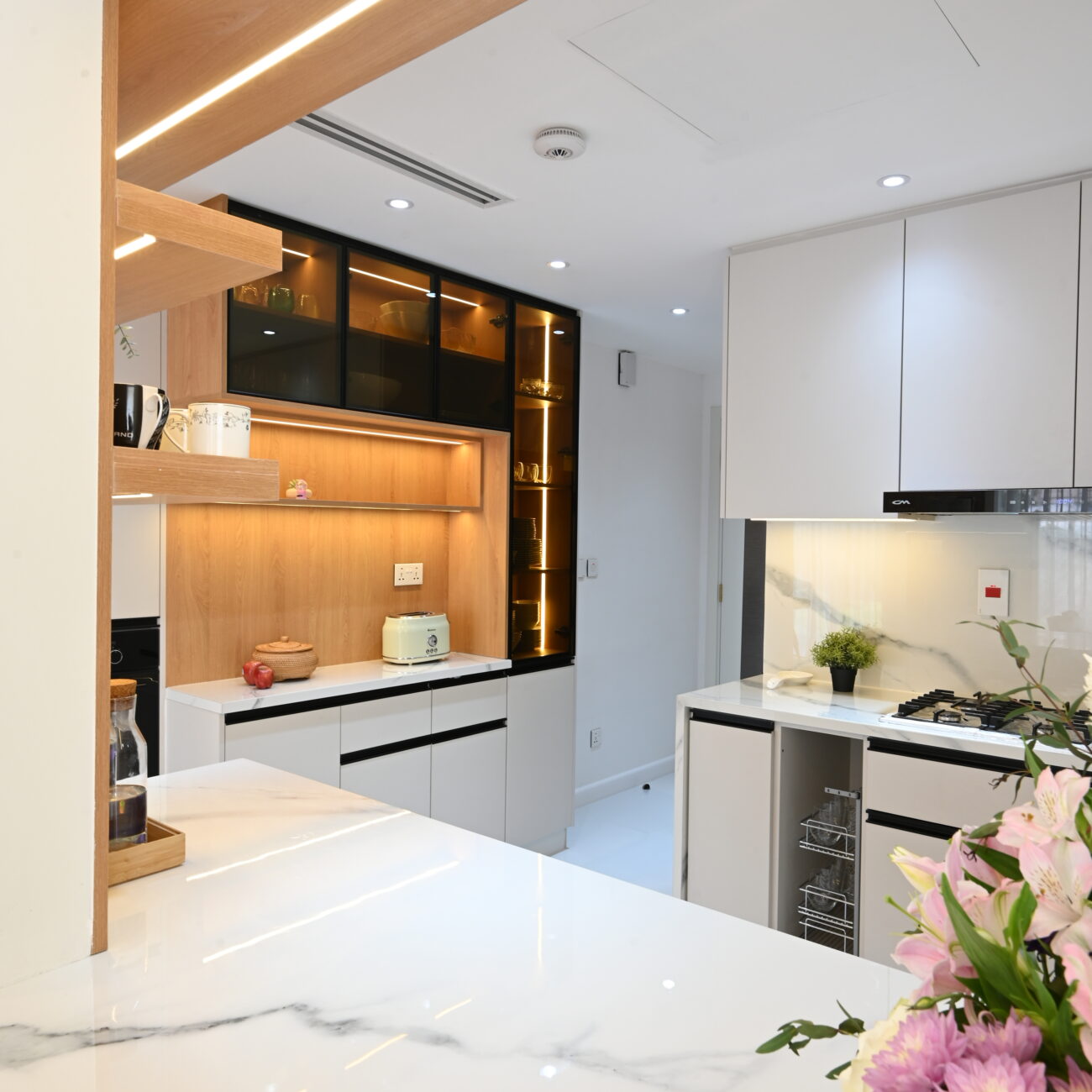 Contemporary kitchen with modern cabinetry and island counter in Dubai villa