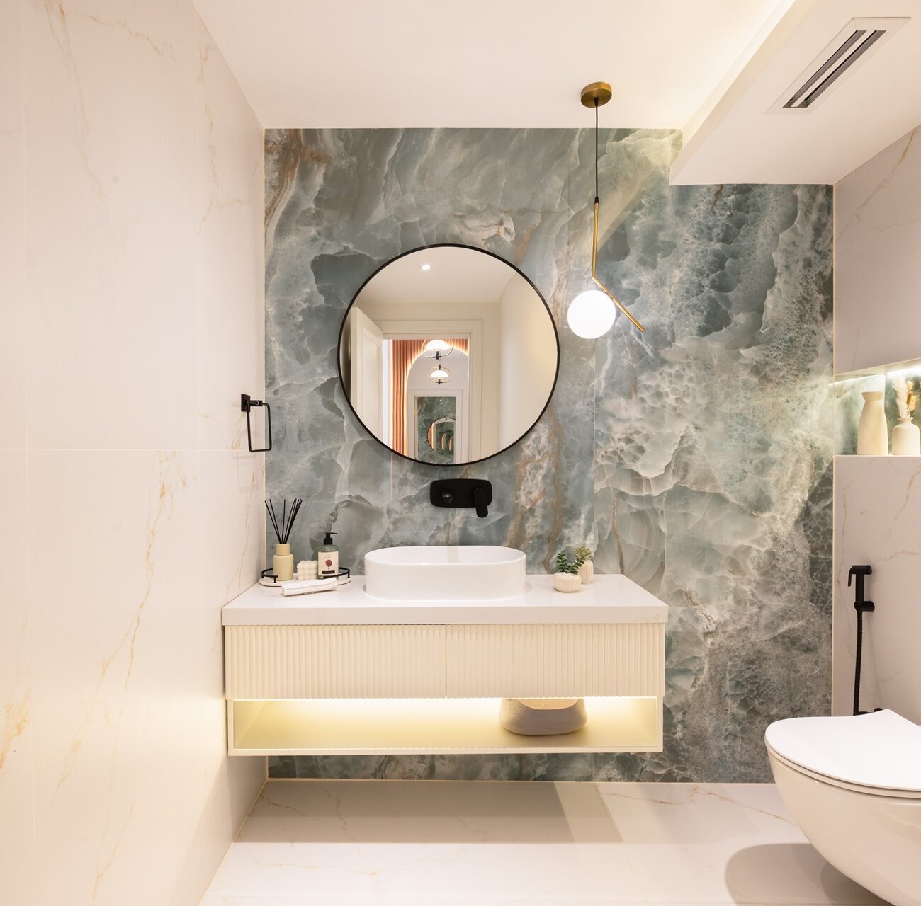 Modern villa washroom with sleek sink design at Jumeirah Village Triangle